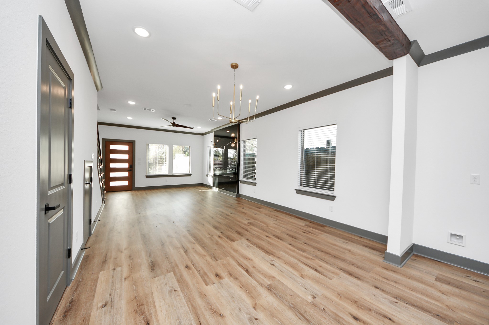7925 Ritz Street, Unit A Houston, TX 77028 - Photo 6 of 35 a view of a big room with wooden floor and windows