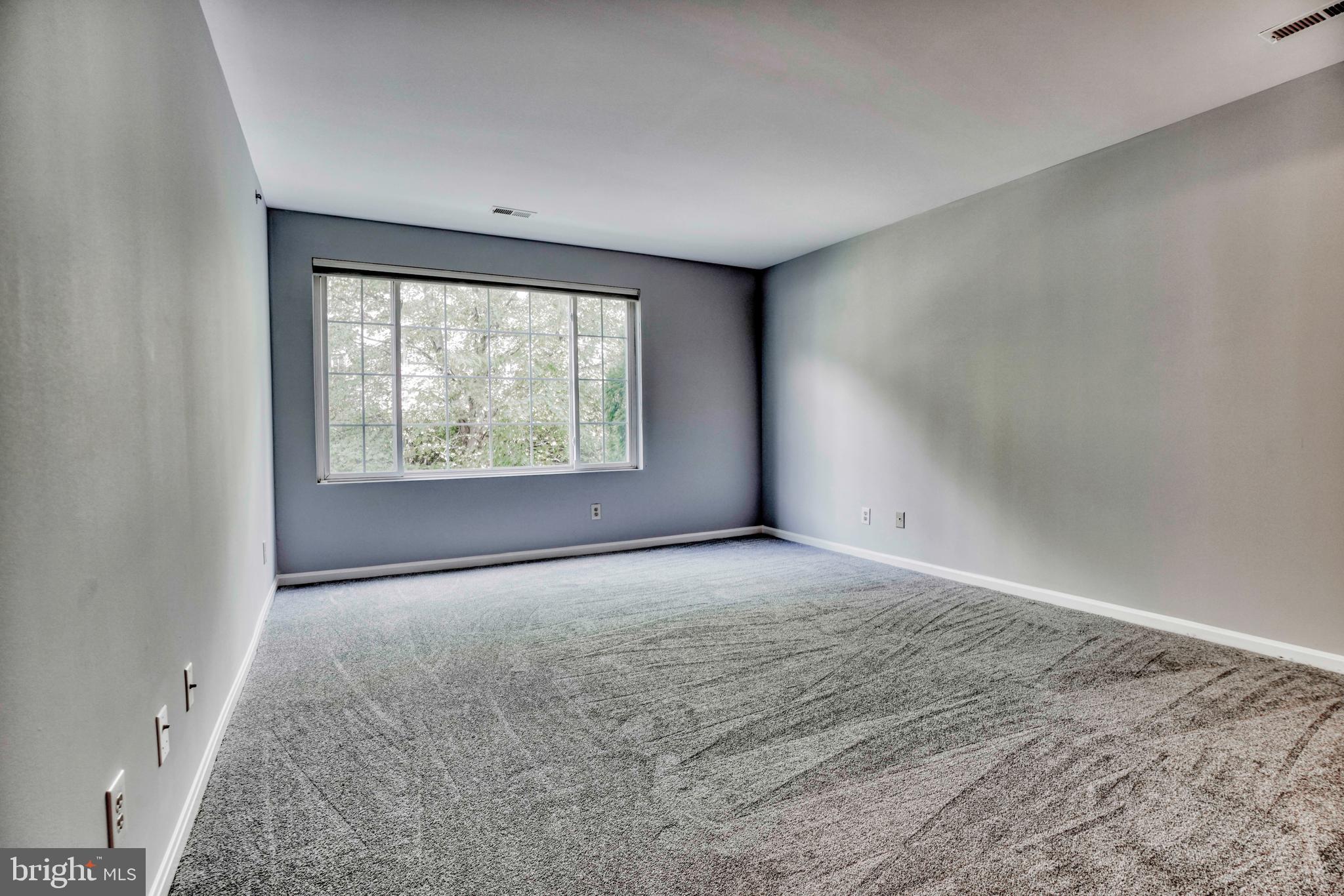 408 Kilree Road, Unit 202 Lutherville-Timonium, MD 21093 - Photo 18 of 33 Primary bedroom with walk-in closet