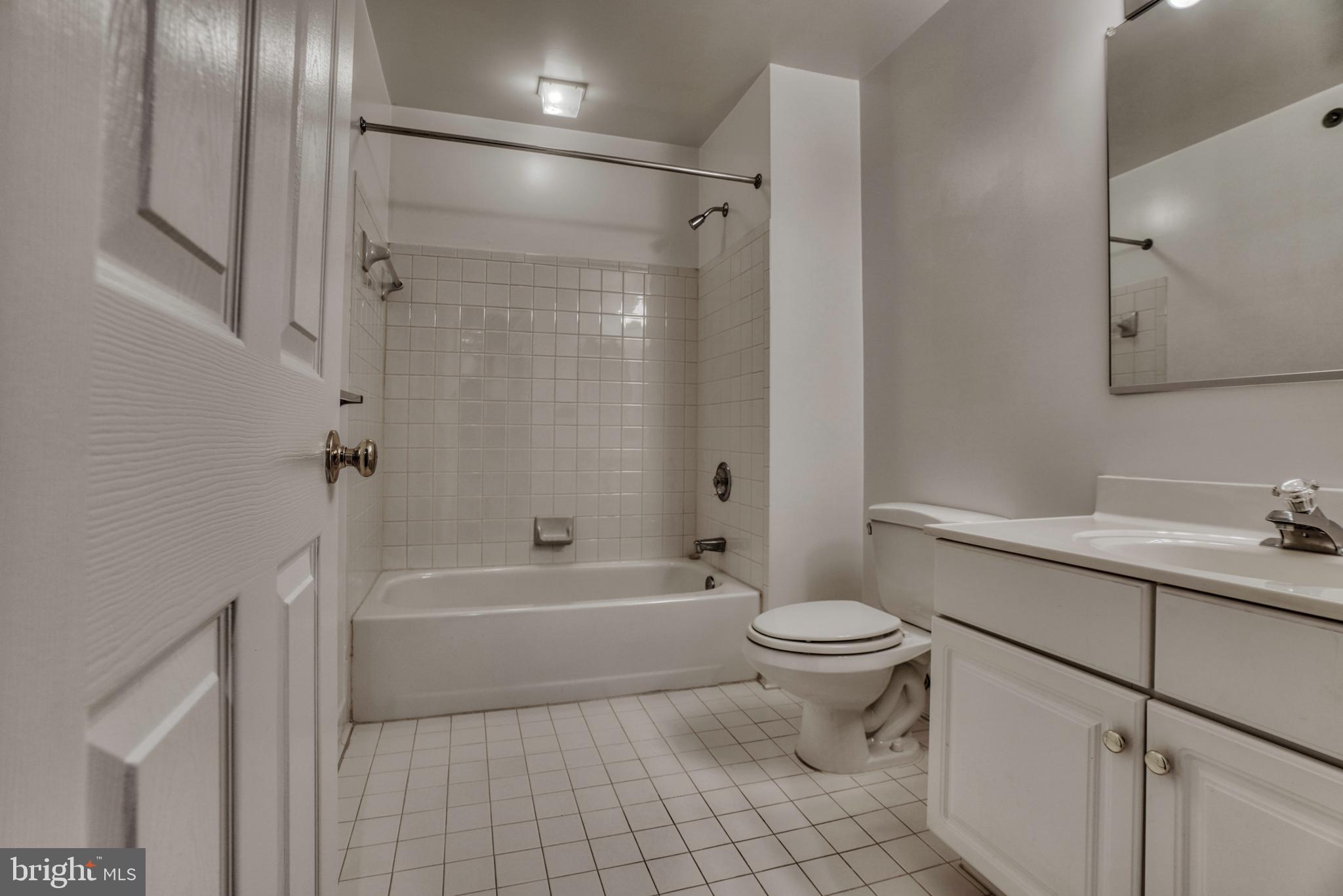 408 Kilree Road, Unit 202 Lutherville-Timonium, MD 21093 - Photo 26 of 33 Hall bath with tub and shower.