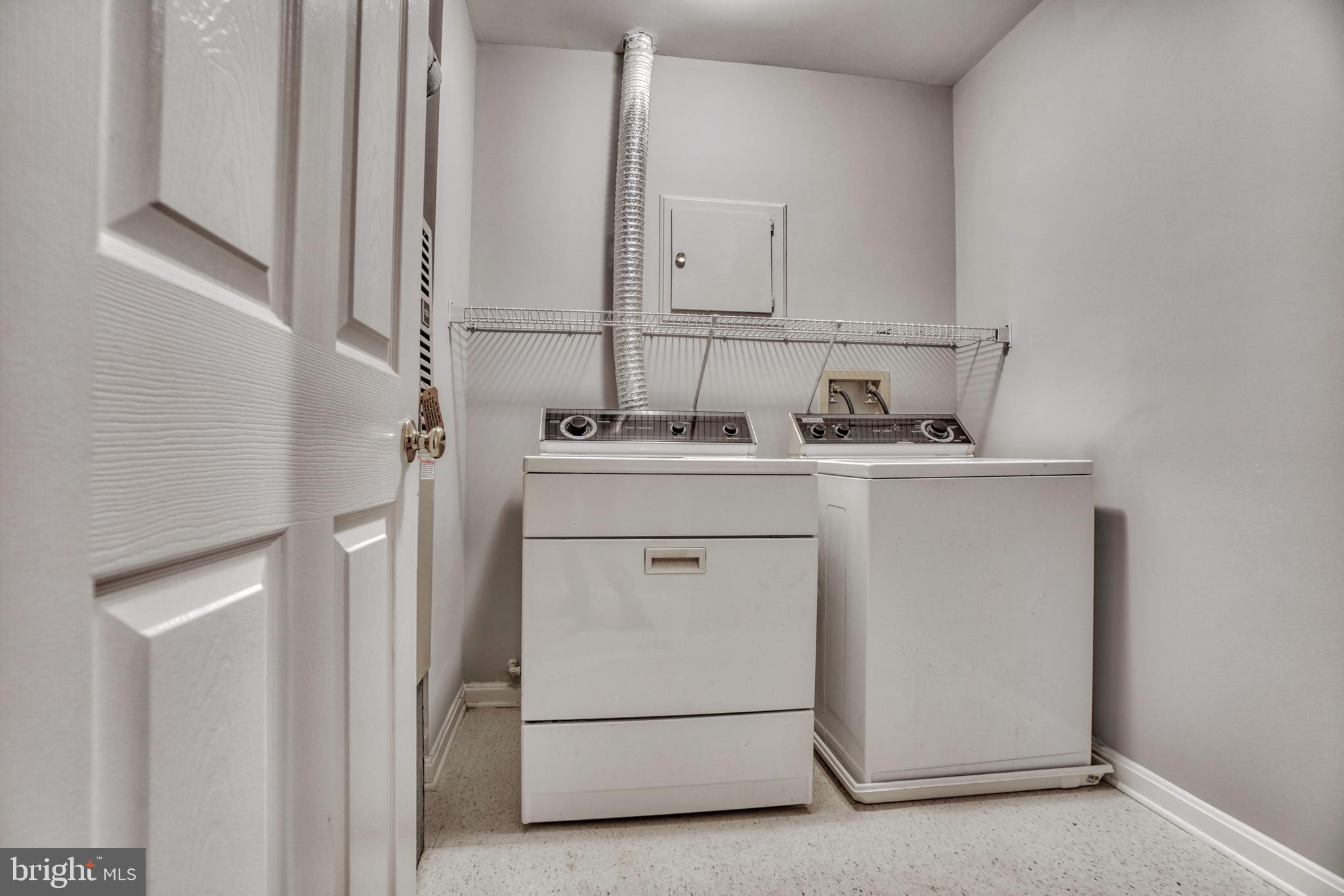 408 Kilree Road, Unit 202 Lutherville-Timonium, MD 21093 - Photo 29 of 33 Full size laundry room with washer and dryer.