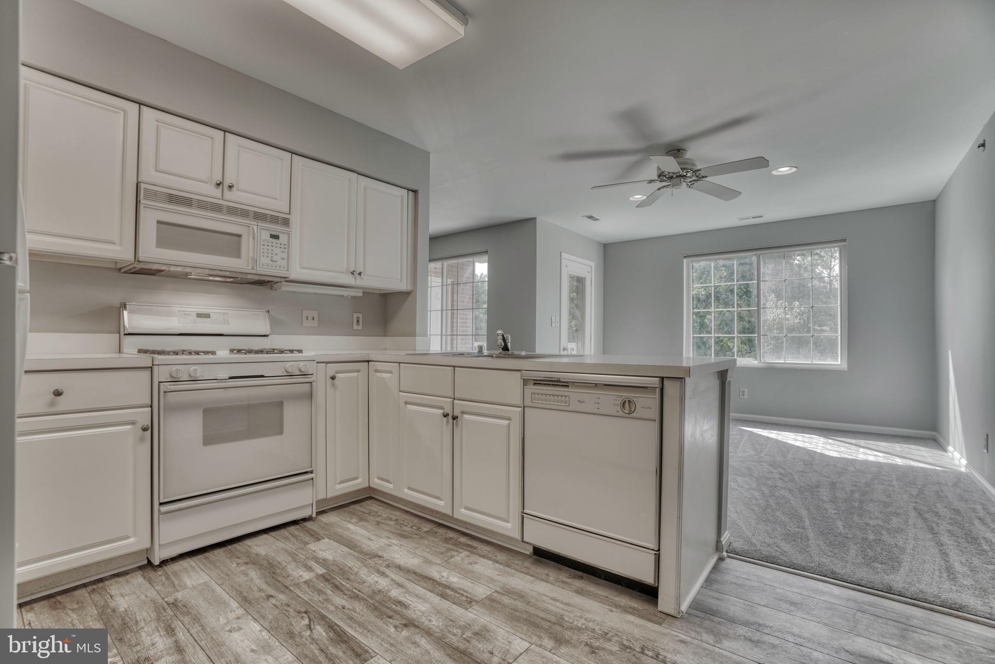 408 Kilree Road, Unit 202 Lutherville-Timonium, MD 21093 - Photo 7 of 33 Spacious kitchen with new flooring . Note fan.