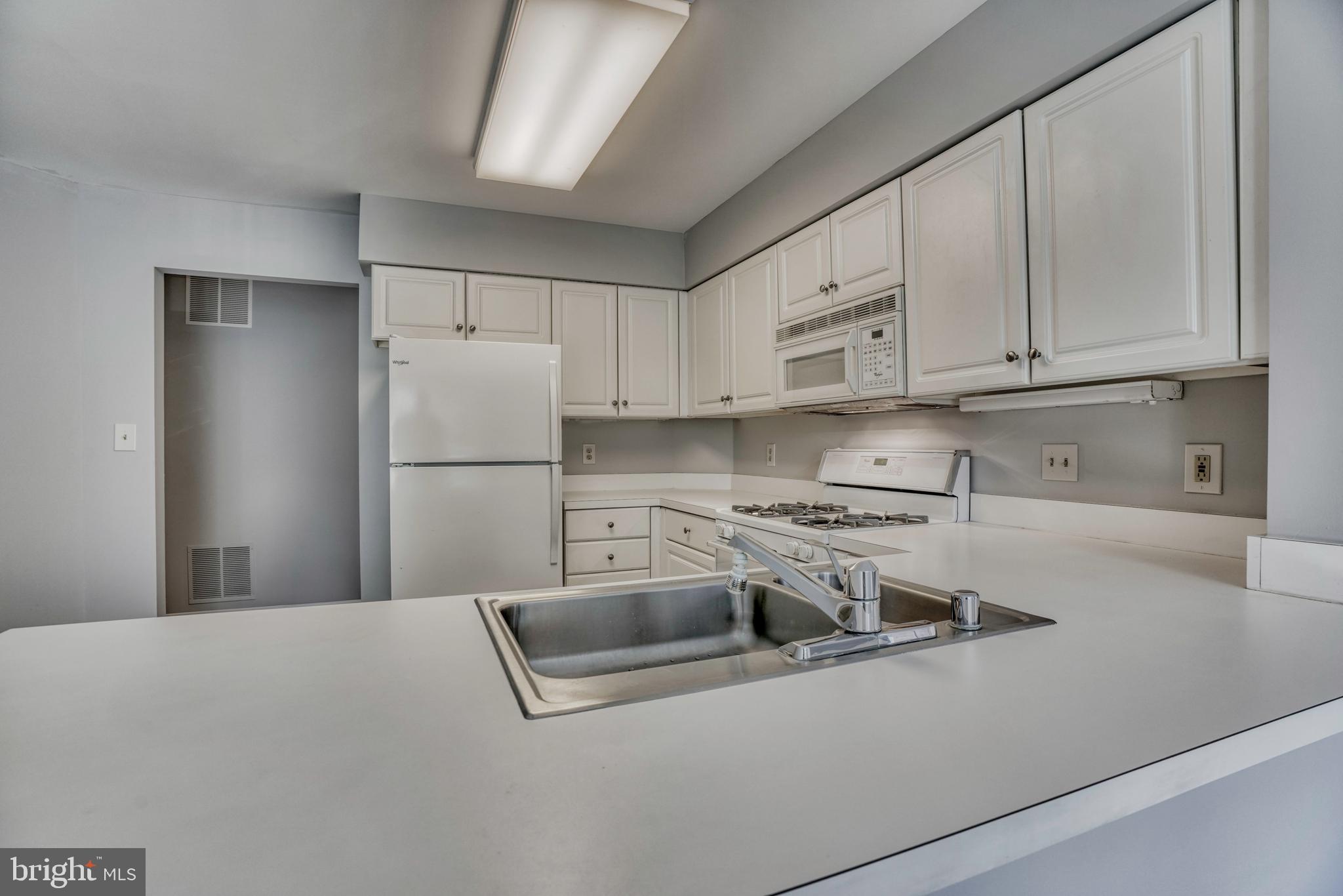 408 Kilree Road, Unit 202 Lutherville-Timonium, MD 21093 - Photo 9 of 33 Fully equipped kitchen including new refrigerator.