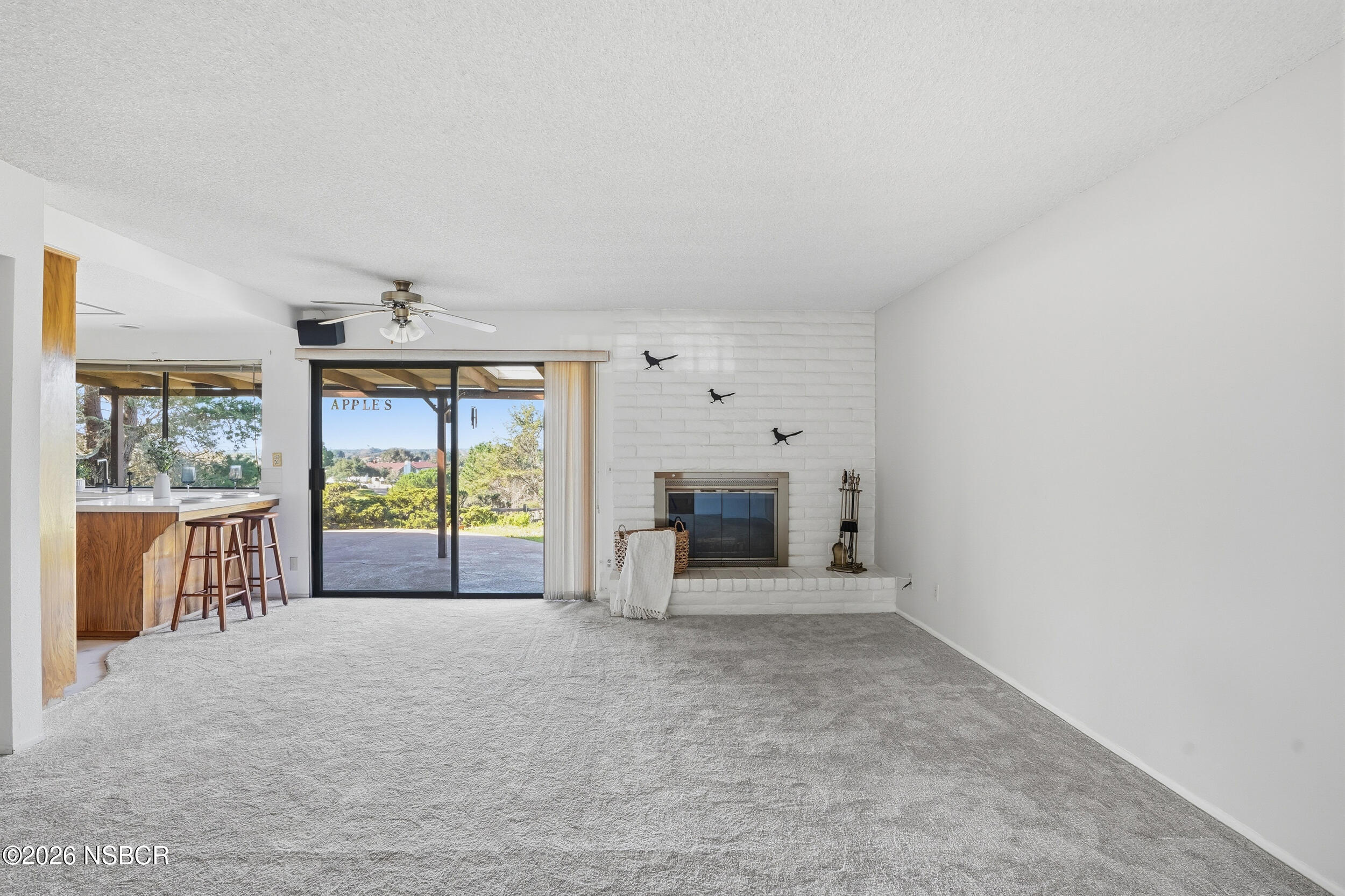 649 Burning Tree Way Lompoc, CA 93436 - Photo 14 of 72 an empty room with furniture and large windows