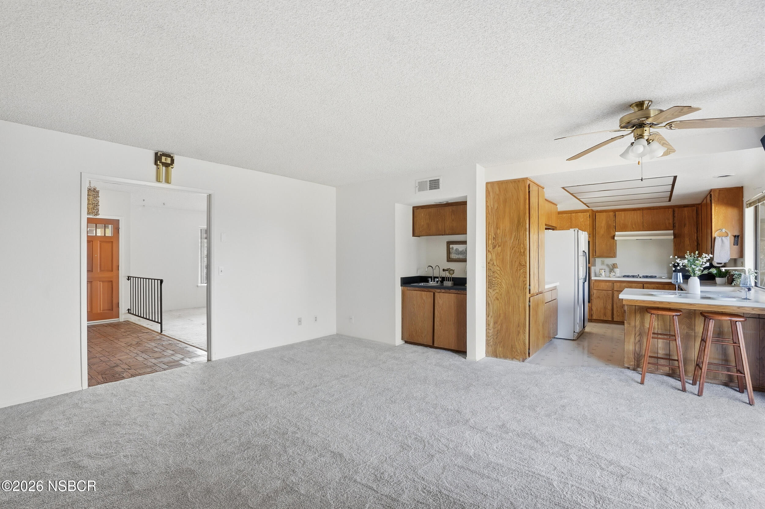 649 Burning Tree Way Lompoc, CA 93436 - Photo 18 of 72 a view of a kitchen with refrigerator and furniture