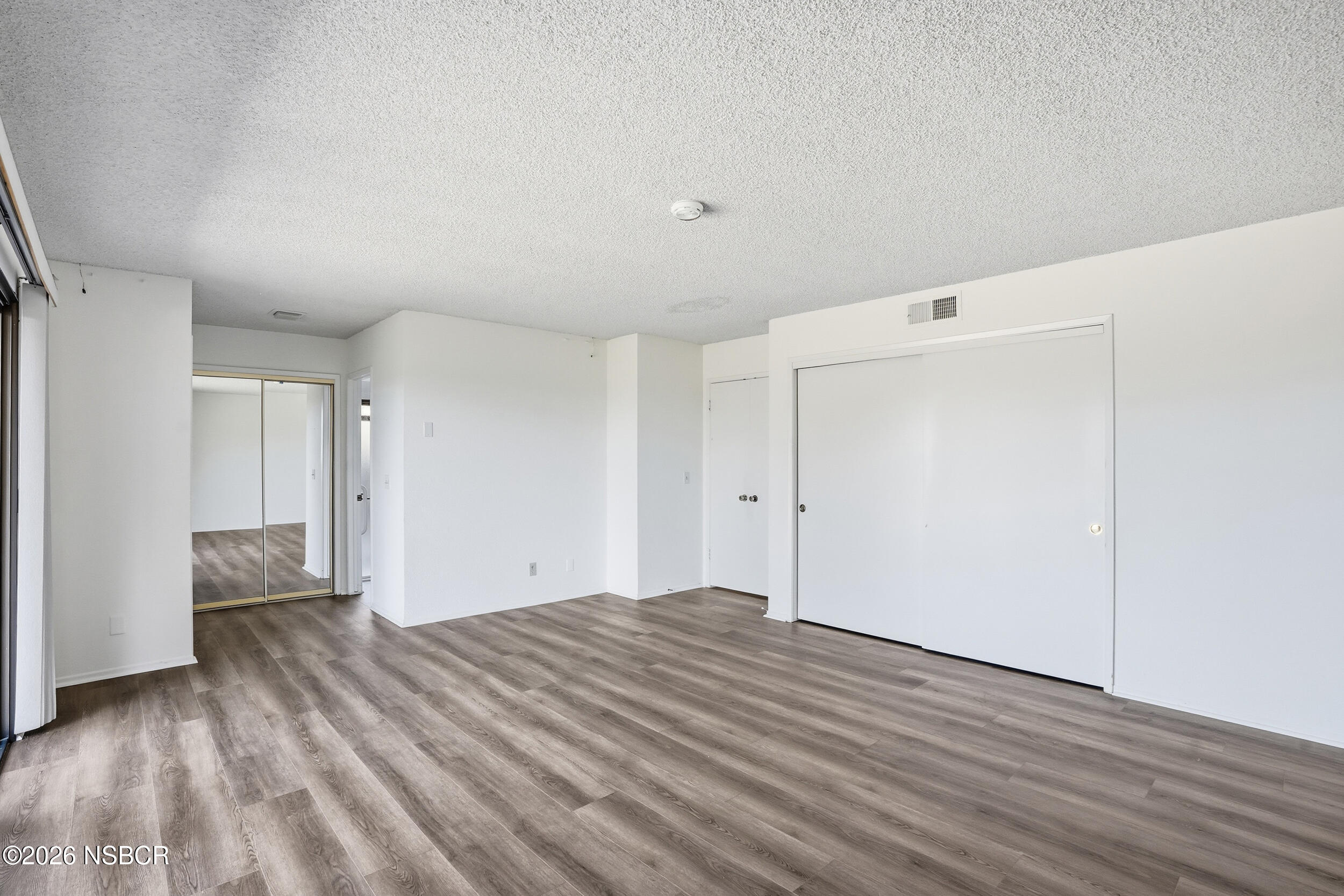 649 Burning Tree Way Lompoc, CA 93436 - Photo 34 of 72 a view of empty room with wooden floor