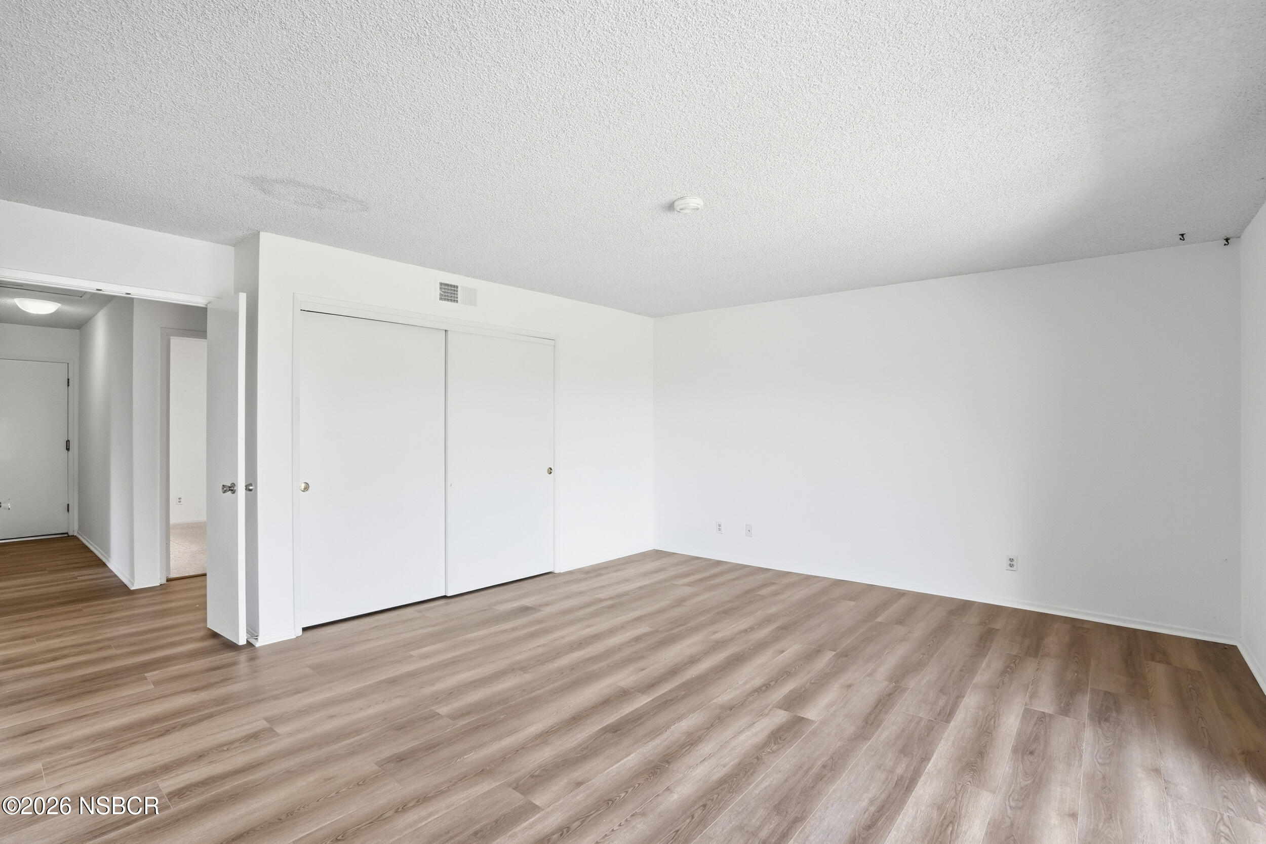 649 Burning Tree Way Lompoc, CA 93436 - Photo 35 of 72 a view of empty room with wooden floor