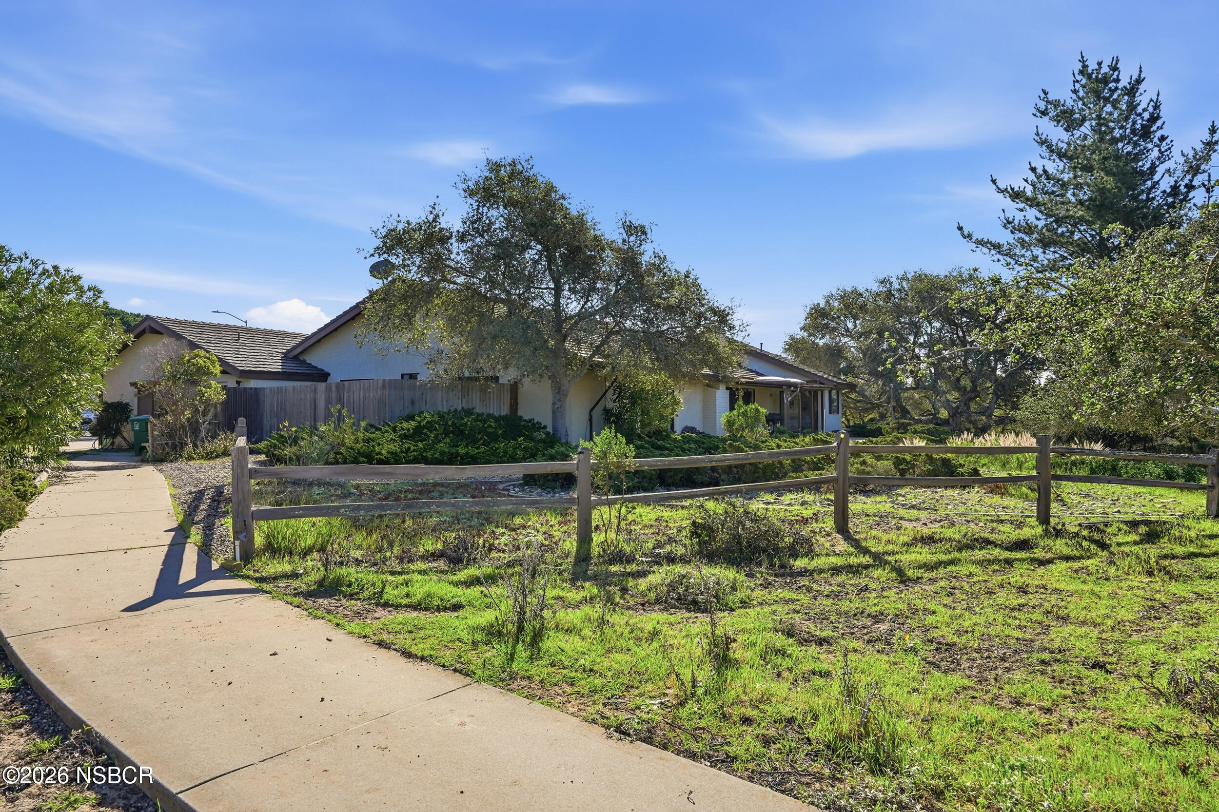 649 Burning Tree Way Lompoc, CA 93436 - Photo 53 of 72 a view of a lake with a house in the background