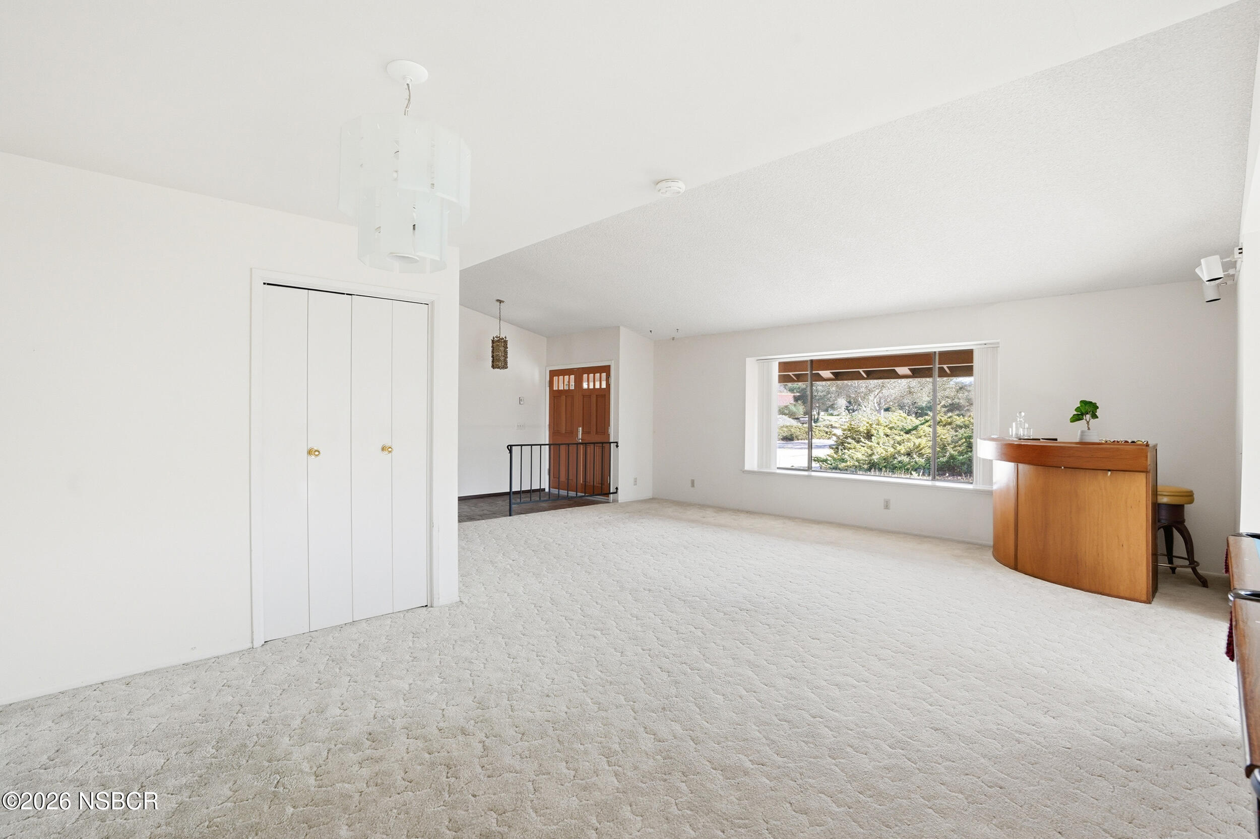 649 Burning Tree Way Lompoc, CA 93436 - Photo 10 of 72 an empty room with furniture and a window