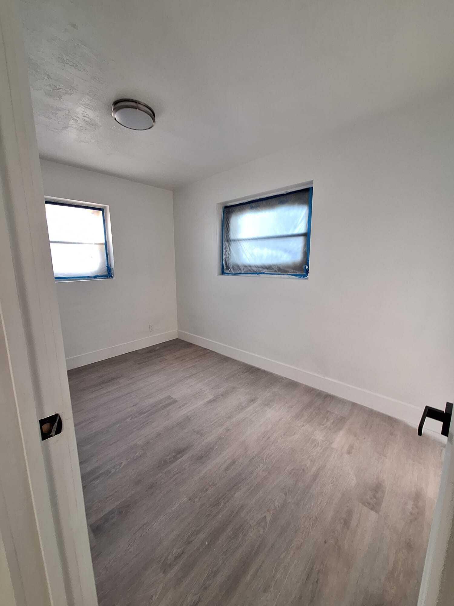 1000 West 1st Street Riviera Beach, FL 33404 - Photo 5 of 8 an empty room with a workspace