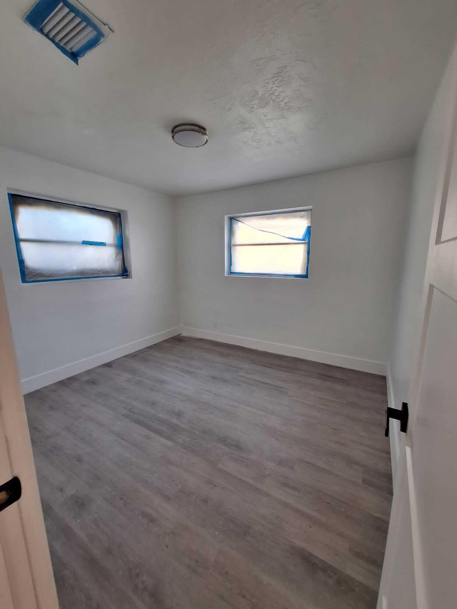 1000 West 1st Street Riviera Beach, FL 33404 - Photo 6 of 8 wooden floor in an empty room