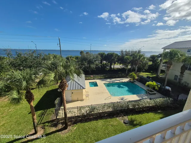 a view of a garden with lawn chairs