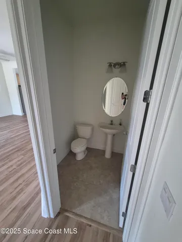 a kitchen with stainless steel appliances granite countertop a refrigerator a sink a stove and a refrigerator