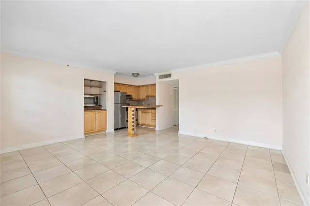 a view of kitchen with furniture and white cabinets