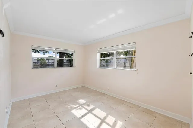 a view of empty room with windows