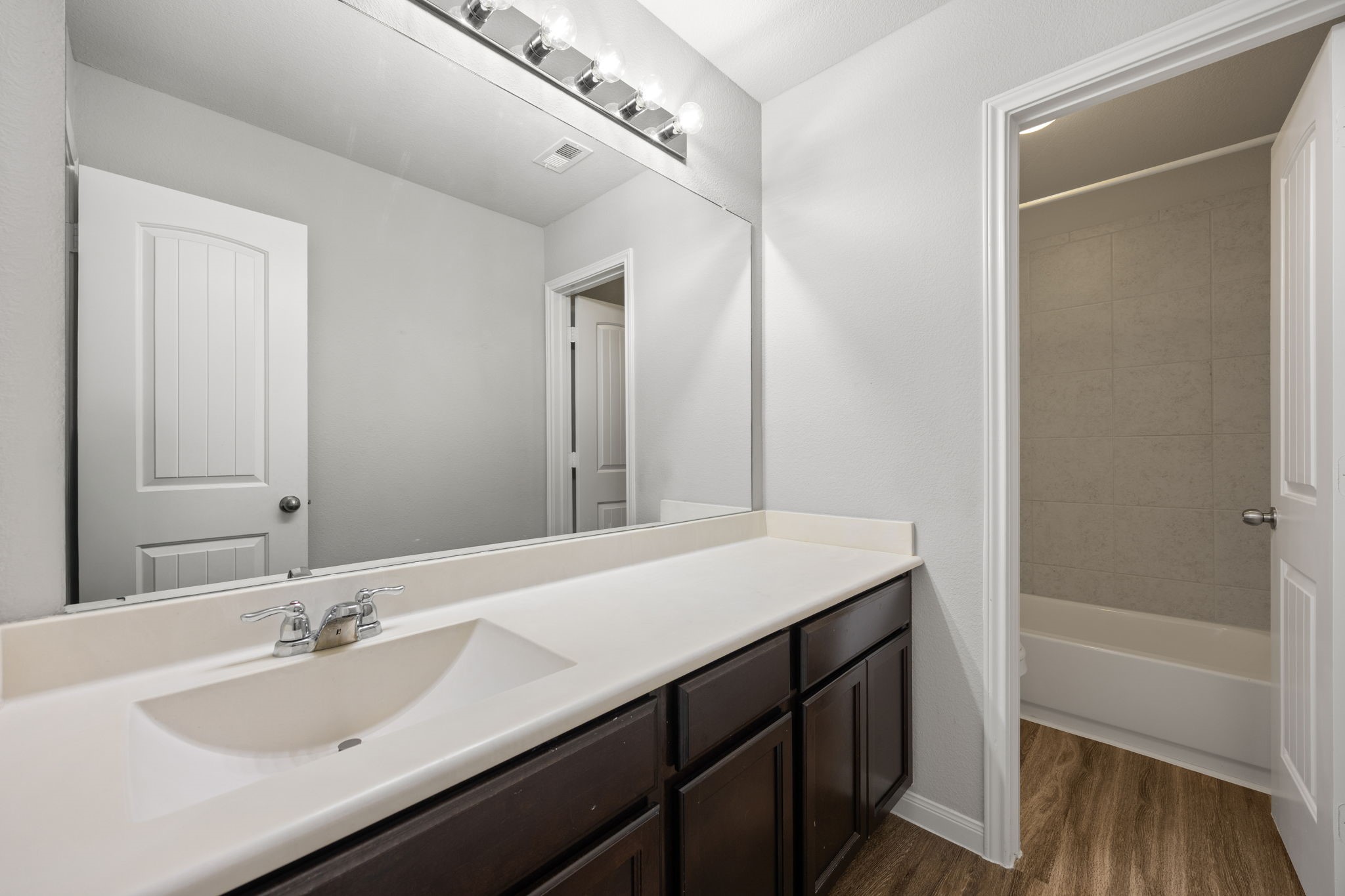 18606 Lansdowne Stream Path Katy, TX 77449 - Photo 33 of 39 a bathroom with a sink and a mirror