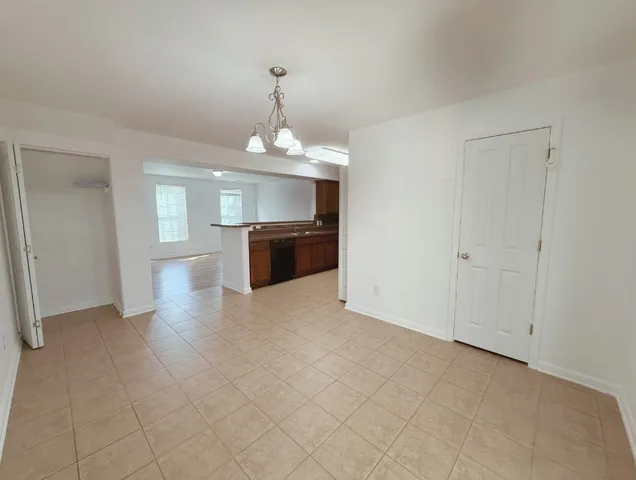 a view of a big room with windows and closet