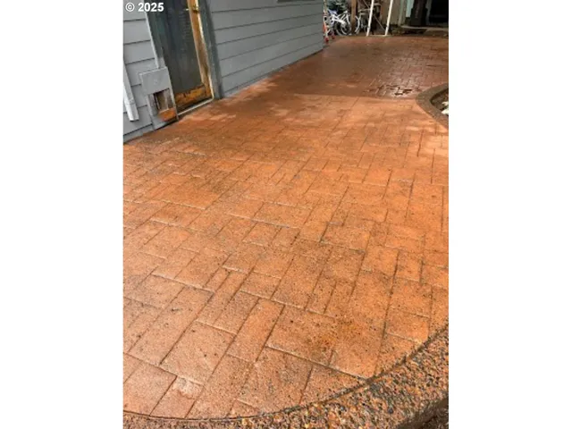 a view of a house with a yard and garage