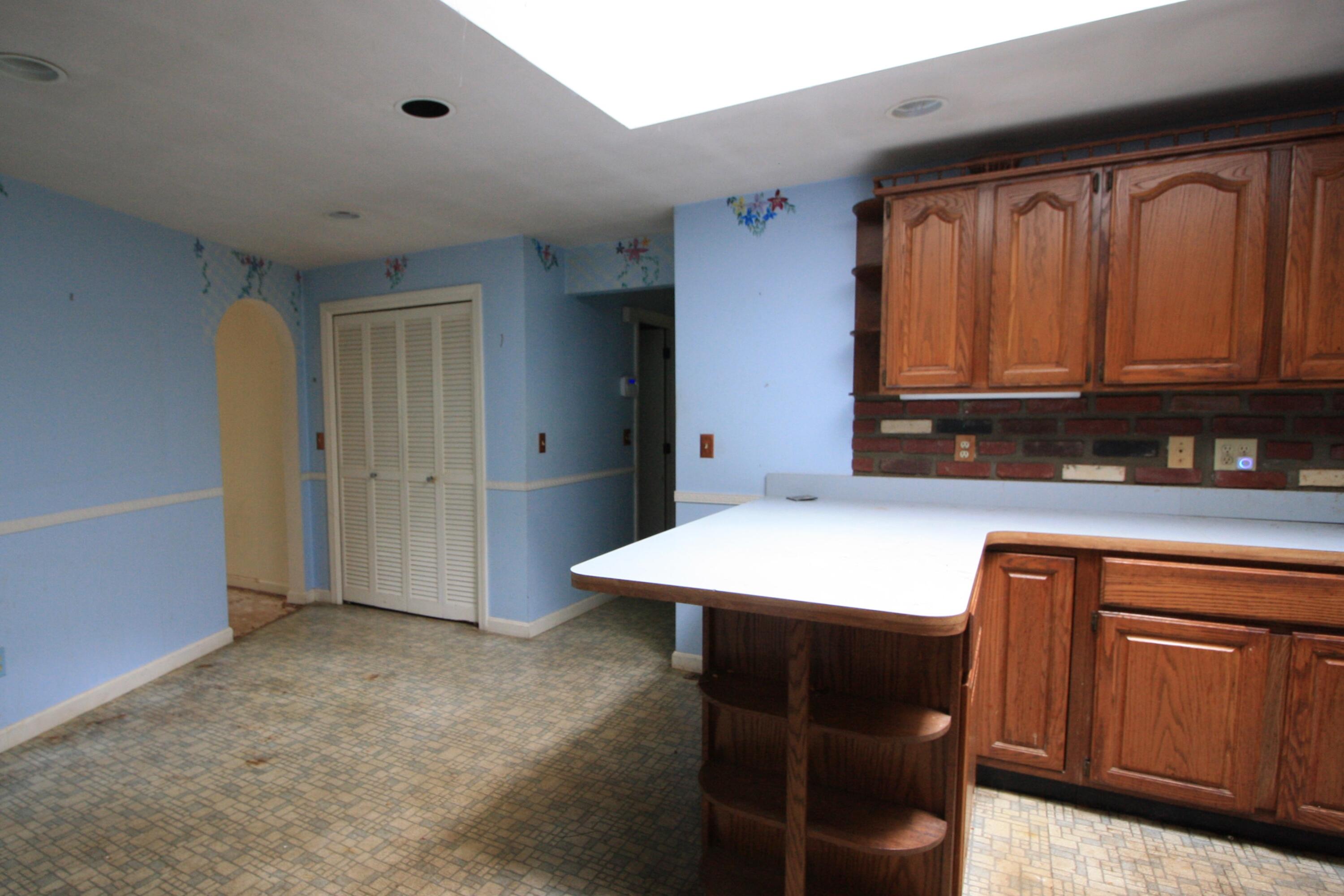 177 Thistle Drive Centerville, MA 02632 - Photo 12 of 22 a kitchen with a refrigerator and cabinets