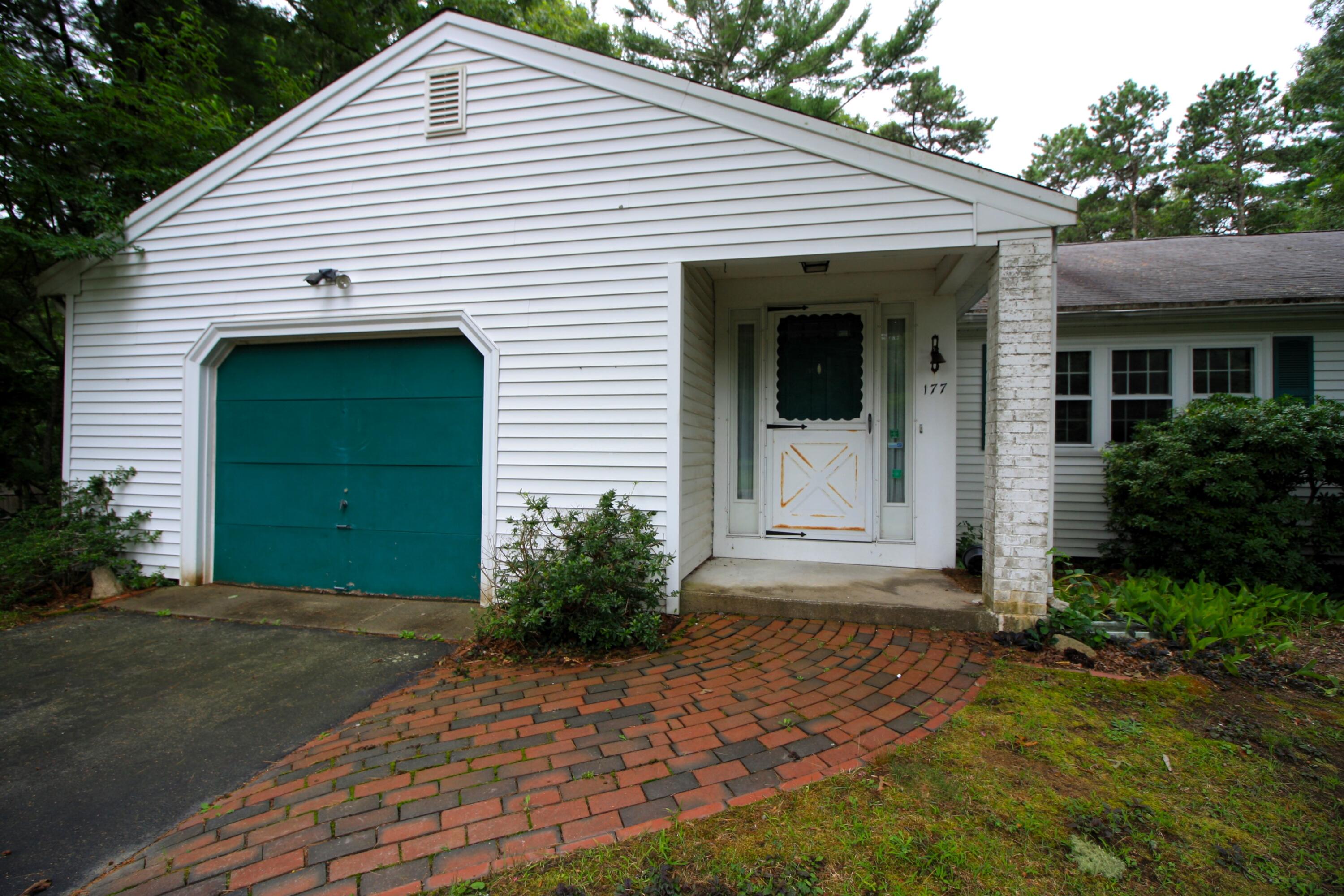 177 Thistle Drive Centerville, MA 02632 - Photo 4 of 22 a front view of a house with a garden