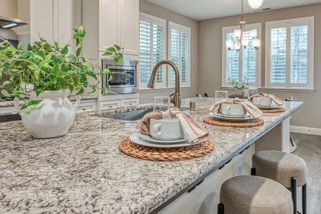 a dining room with furniture and window