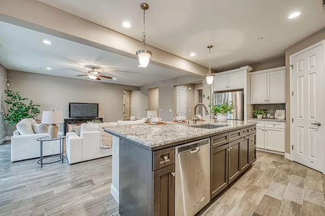 a kitchen with a sink and cabinets