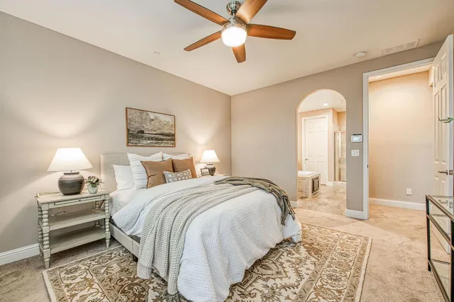 a bed room with a bed and a lamp