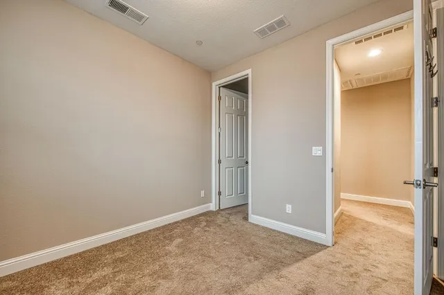 a view of a swimming pool with a yard