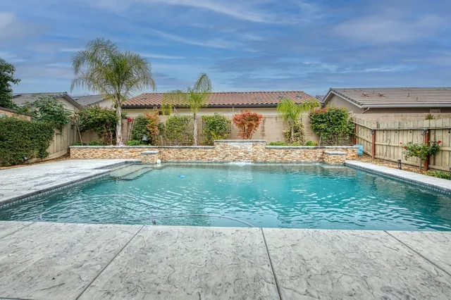 a view of a swimming pool with a patio
