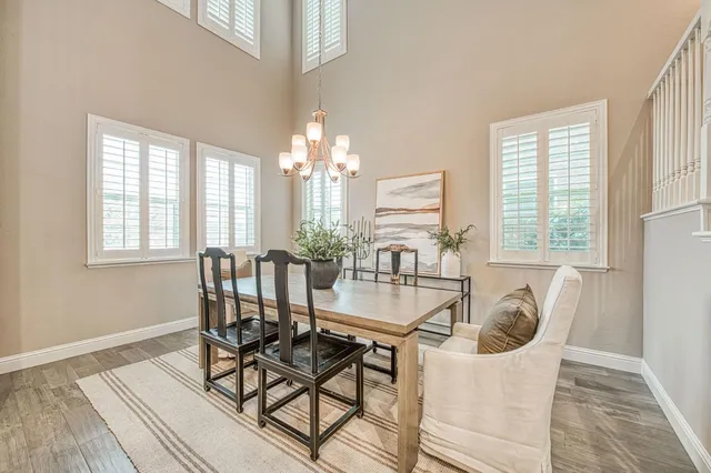 a dining room with furniture and window