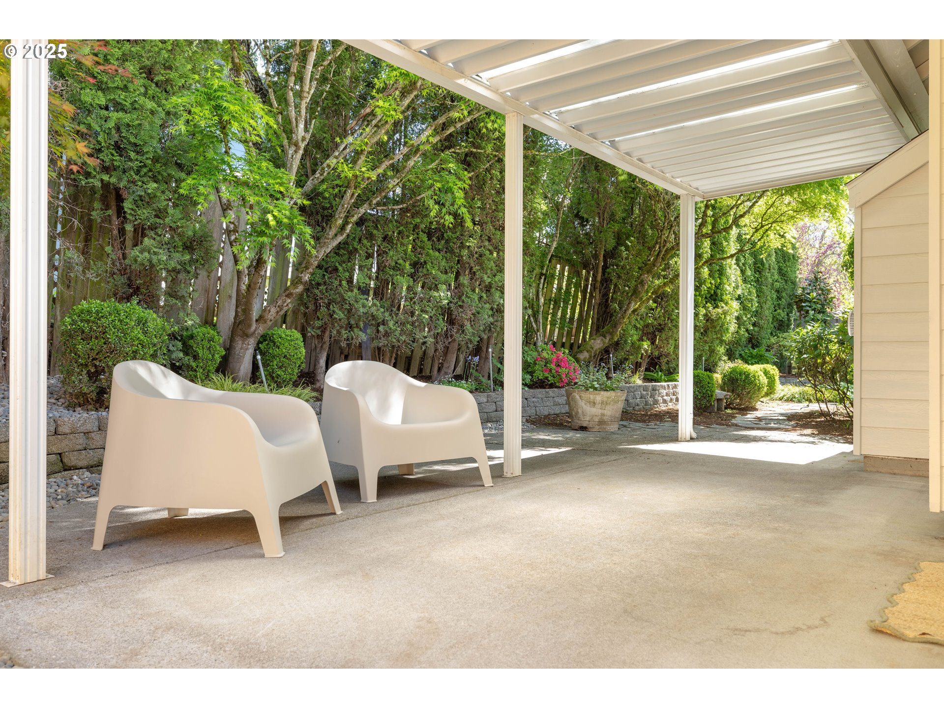 1356 Southeast Larch Way Gresham, OR 97080 - Photo 38 of 41 a view of a patio with couches and chairs under an umbrella