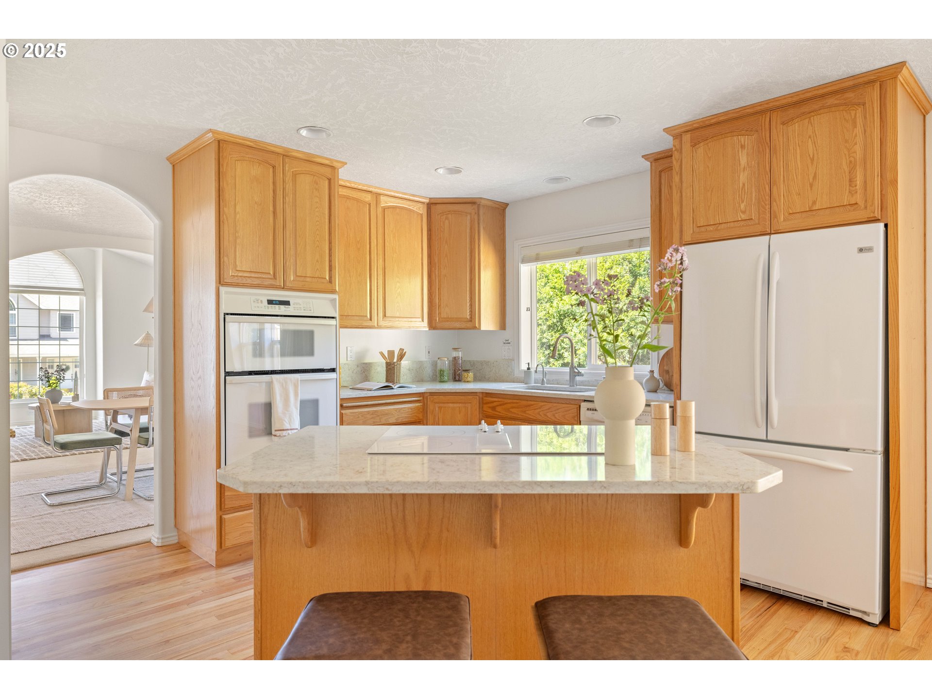 1356 Southeast Larch Way Gresham, OR 97080 - Photo 8 of 41 a kitchen with stainless steel appliances granite countertop a refrigerator a stove and a sink with large cabinets