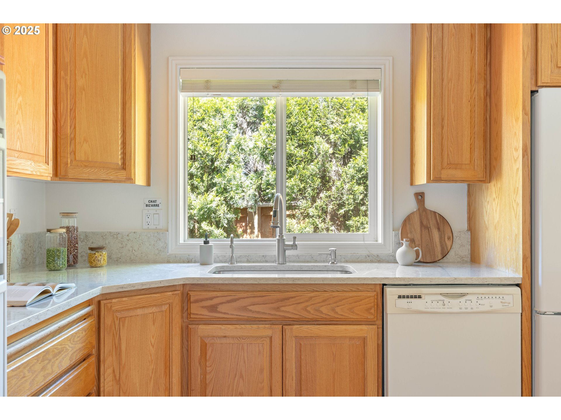 1356 Southeast Larch Way Gresham, OR 97080 - Photo 10 of 41 a kitchen with stainless steel appliances granite countertop a sink a window and next to a window