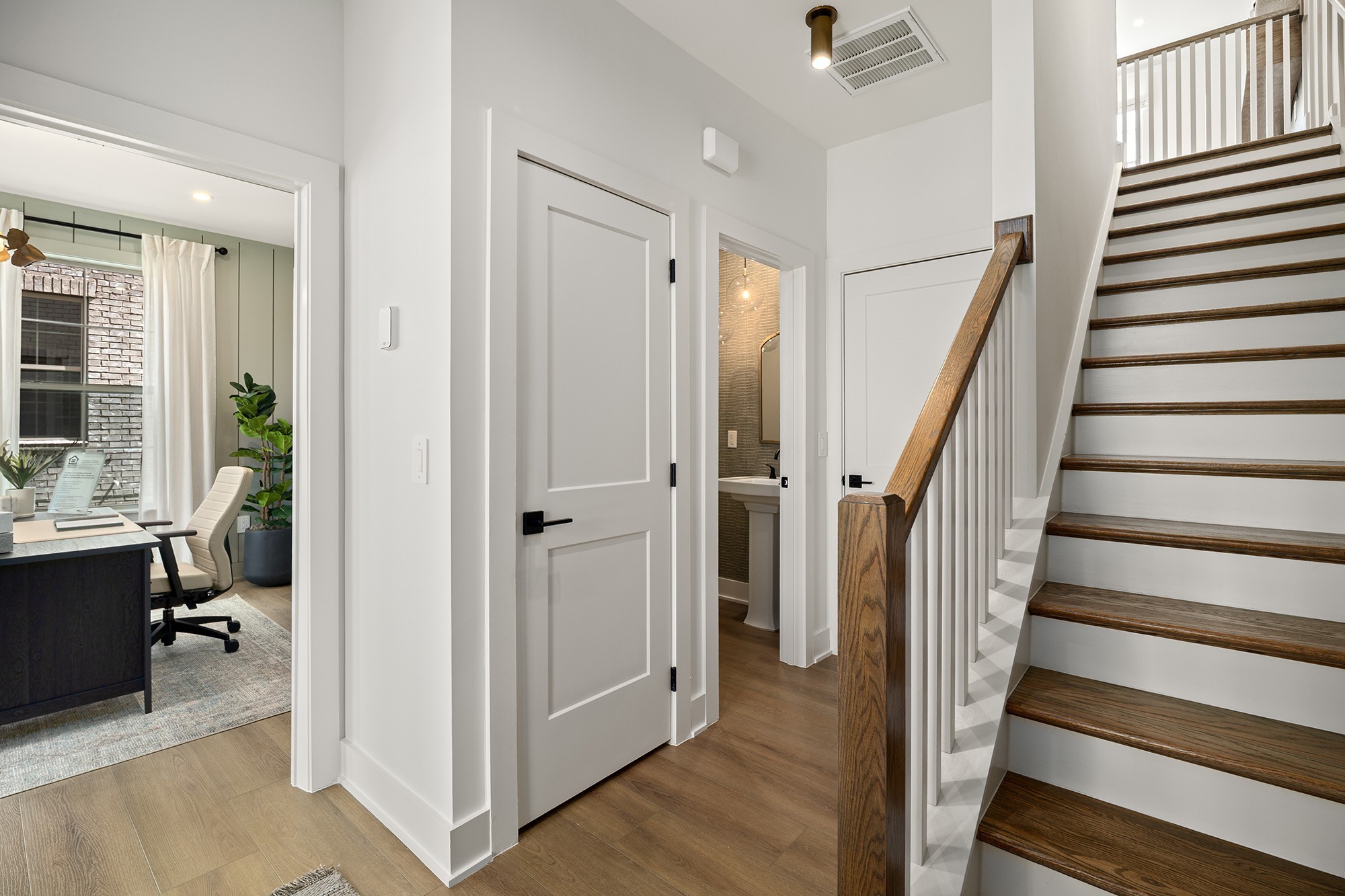 2615 Wilkinson Pike, Unit 1405 Murfreesboro, TN 37129 - Photo 4 of 36 a view of a hallway with wooden floor and staircase