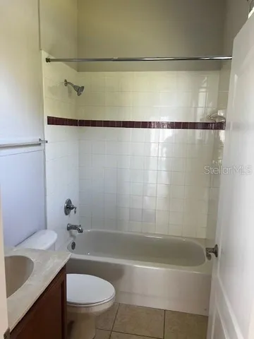 a bathroom with a sink a toilet and a bathtub