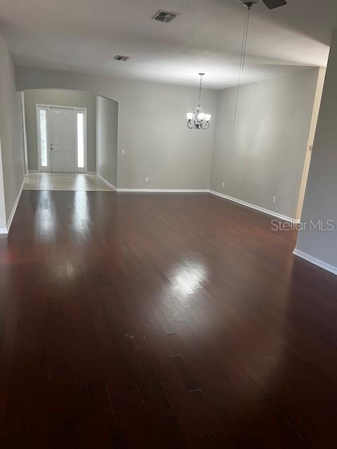 20010 Daytona Way Tampa, FL 33647 - Photo 3 of 19 an empty room with wooden floor and windows