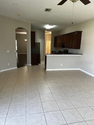a view of a kitchen with a sink and cabinets