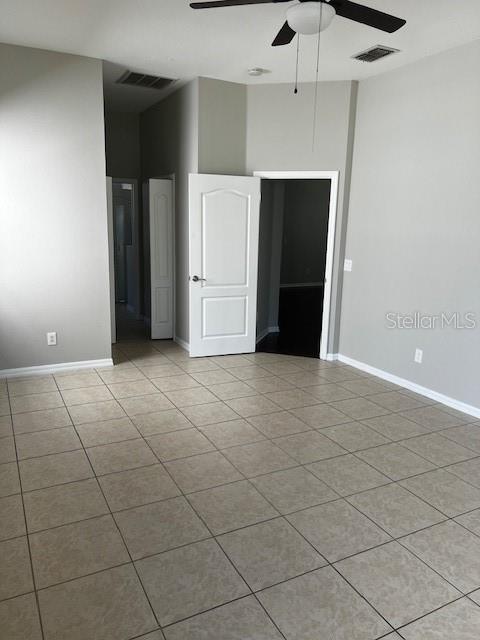20010 Daytona Way Tampa, FL 33647 - Photo 9 of 19 an empty room with a fireplace and cabinet