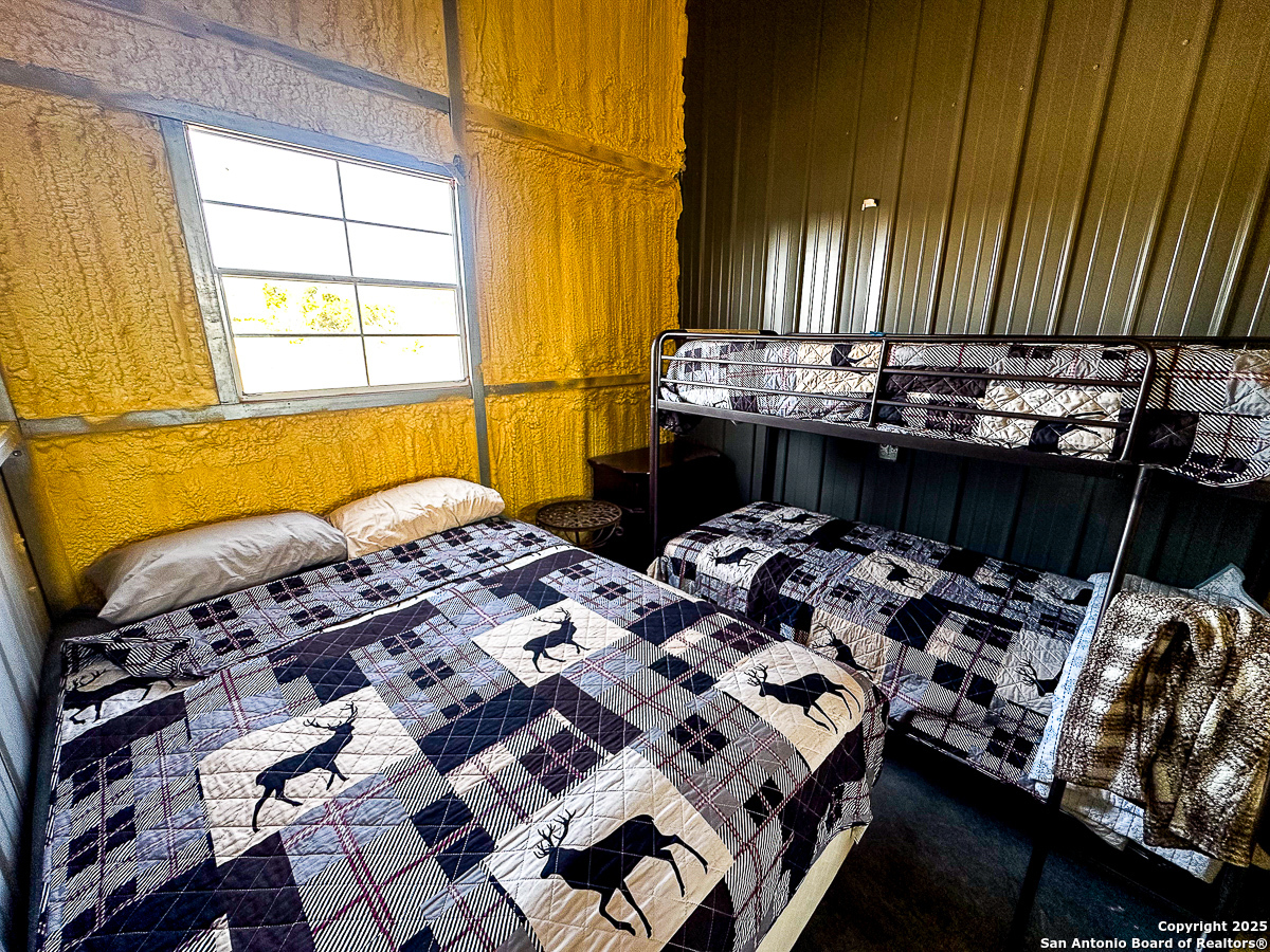 Tbd Marvin Road Comstock, TX 78837 - Photo 11 of 38 a bedroom with bed and wooden floor