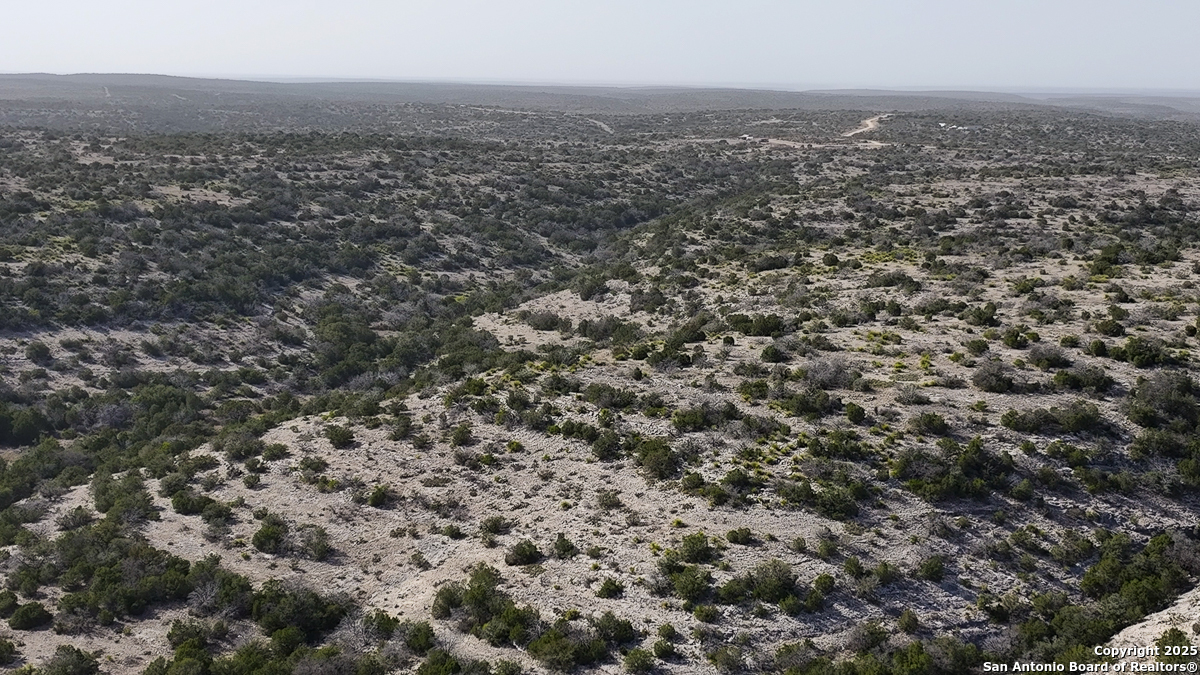 Tbd Marvin Road Comstock, TX 78837 - Photo 31 of 38 an aerial view of house with yard and mountain view in back