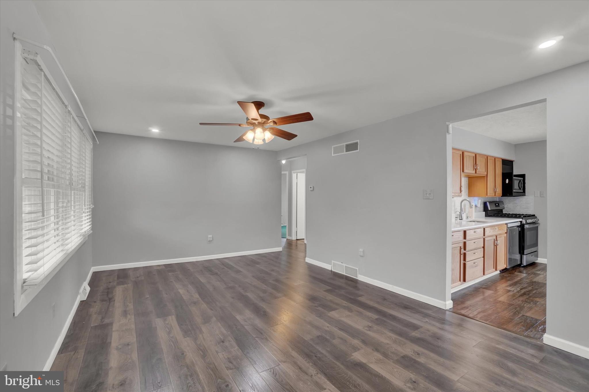 821 Gunnison Road York, PA 17404 - Photo 6 of 28 wooden floor in an empty room with a window