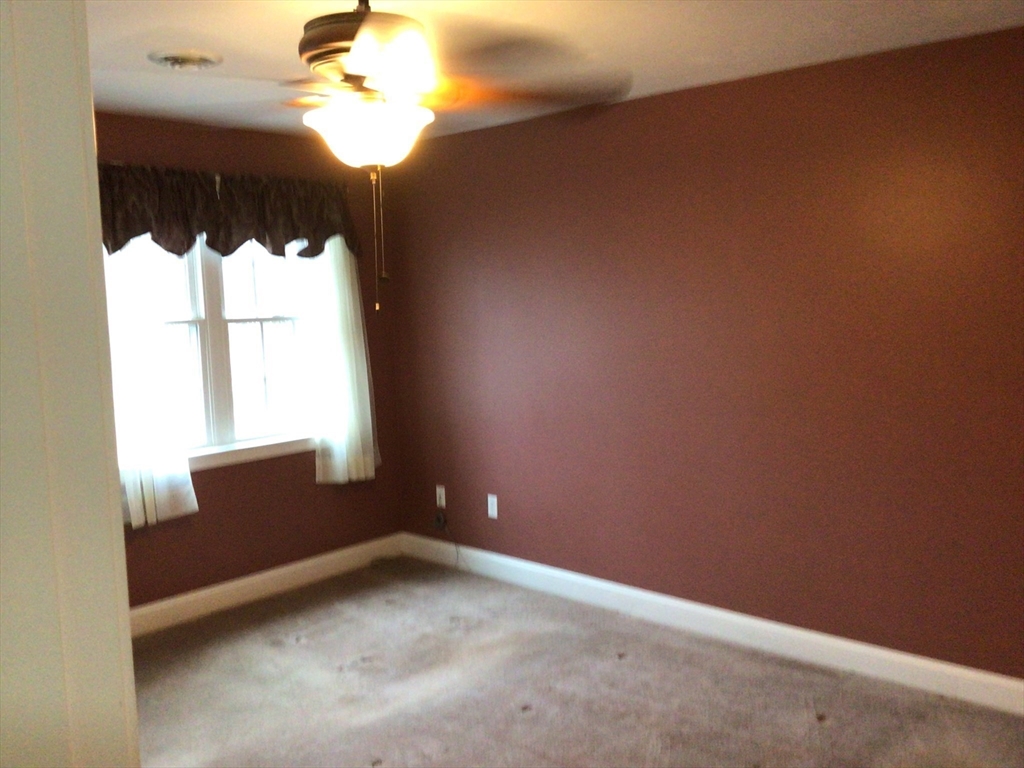 4 Village Way, Unit 4 Rutland, MA 01543 - Photo 14 of 33 a view of an empty room and window