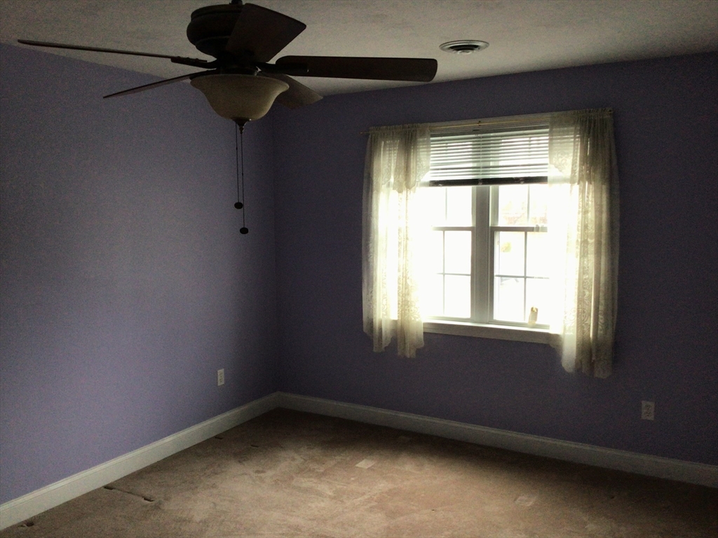 4 Village Way, Unit 4 Rutland, MA 01543 - Photo 22 of 33 a view of an empty room with a window