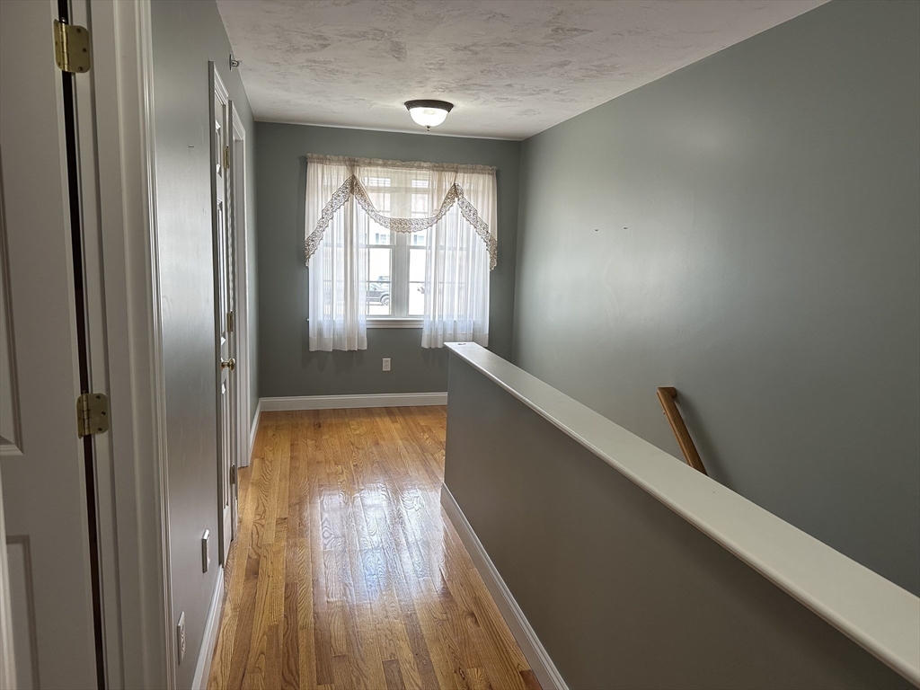 4 Village Way, Unit 4 Rutland, MA 01543 - Photo 25 of 33 a view of room with window and wooden floor