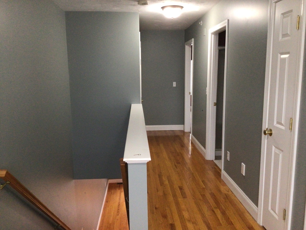 4 Village Way, Unit 4 Rutland, MA 01543 - Photo 26 of 33 a view of a room with wooden floor and staircase