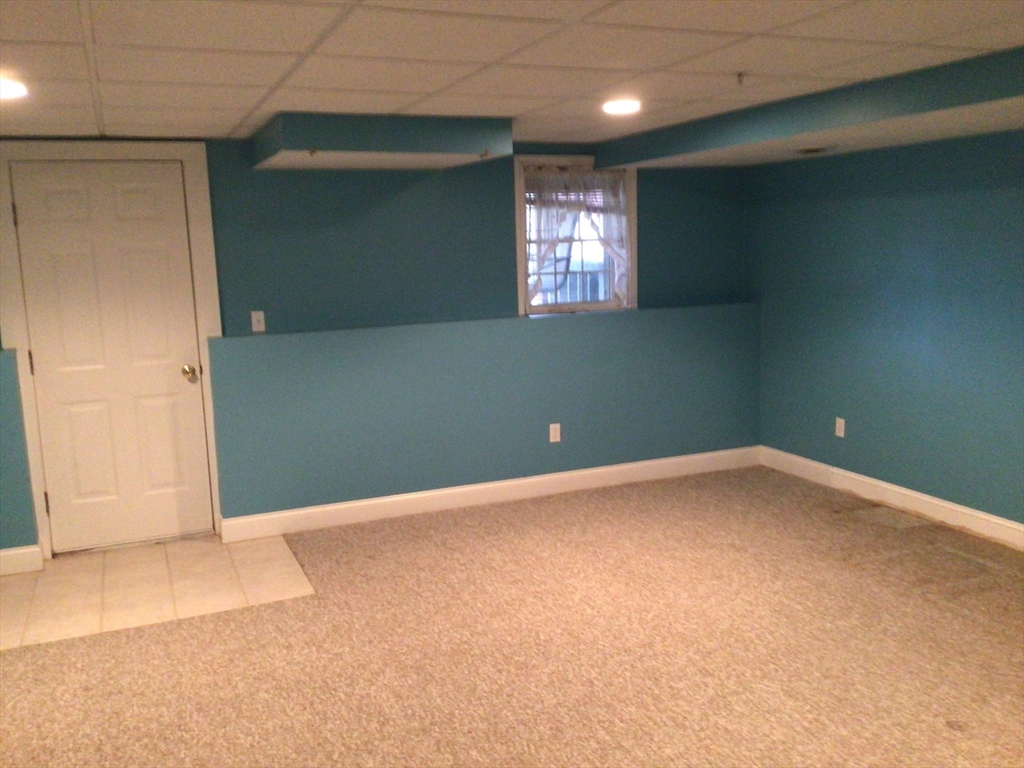 4 Village Way, Unit 4 Rutland, MA 01543 - Photo 29 of 33 an empty room with windows