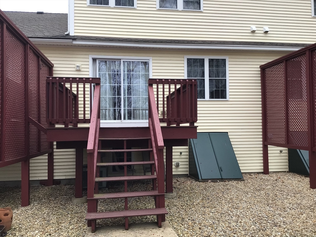 4 Village Way, Unit 4 Rutland, MA 01543 - Photo 4 of 33 a front view of a house with a window