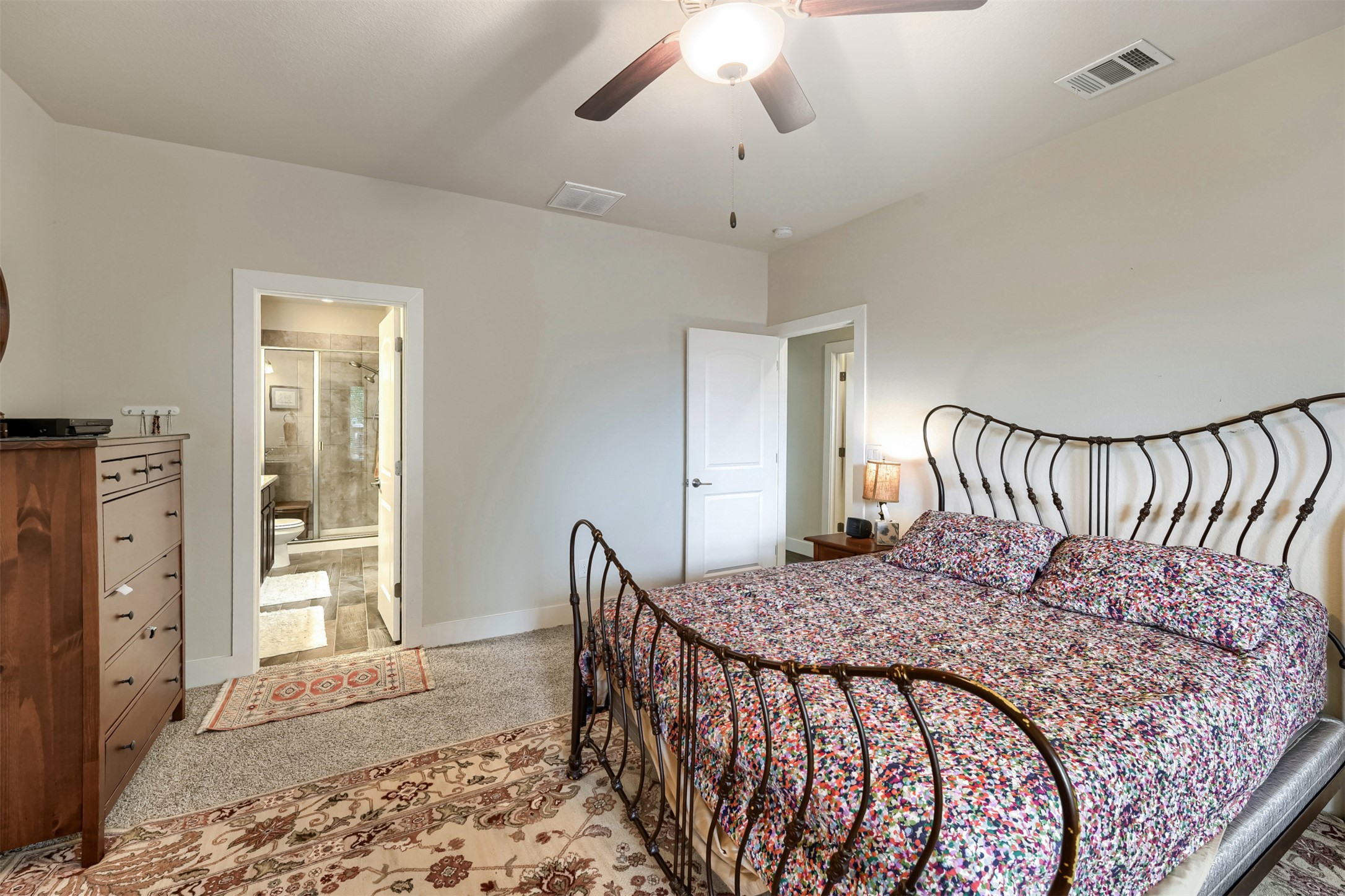 418 High Tech Drive Georgetown, TX 78626 - Photo 15 of 34 Carpeted bedroom featuring a ceiling fan with integrated lighting