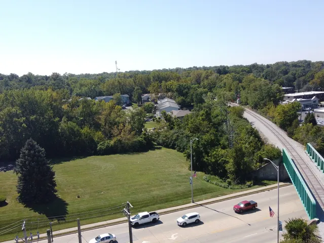 a view of a swimming pool with a yard