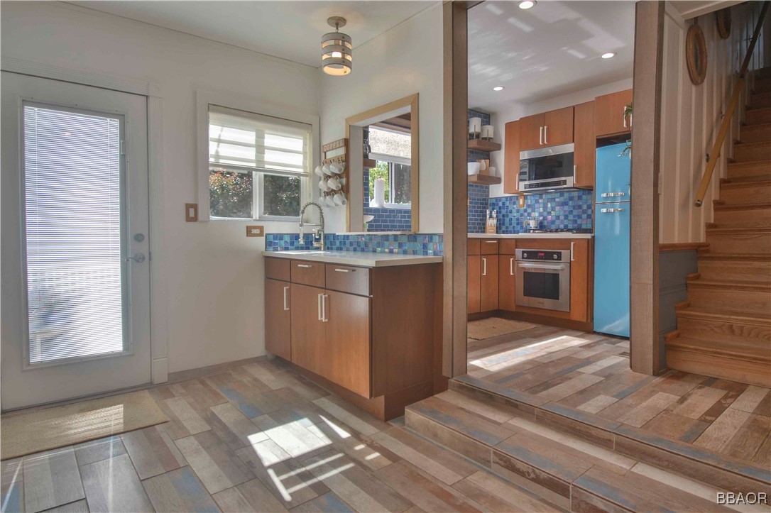 381 Maple Drive Lake Arrowhead, CA 92352 - Photo 12 of 26 a kitchen with stainless steel appliances granite countertop a stove and a sink