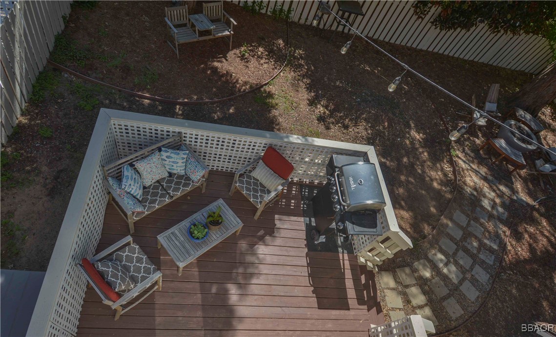 381 Maple Drive Lake Arrowhead, CA 92352 - Photo 15 of 26 a view of staircase with wooden floor and a rug
